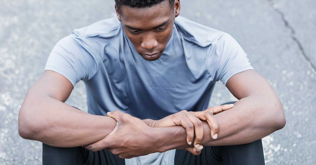 Black-Athlete-Sitting-and-Thinking